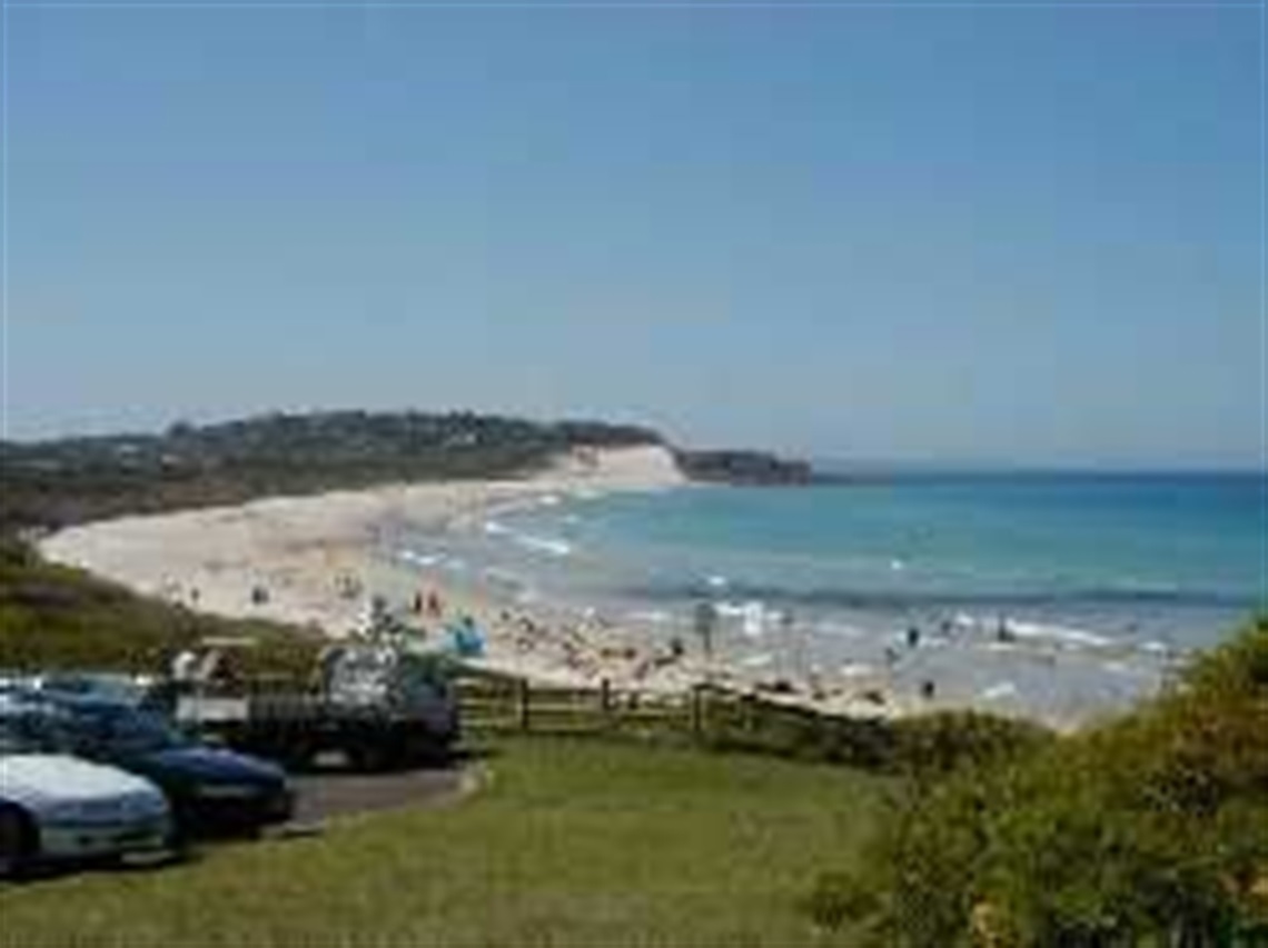 This image shows One Mile Beach from the Cliff Road carpark